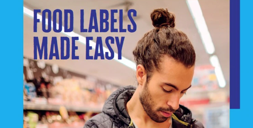 The front cover of the Food labels made easy guide, showing a man in a supermarket looking down at some food packaging