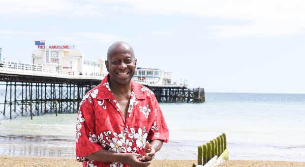 Dave Benson-Philips smiling at the beach