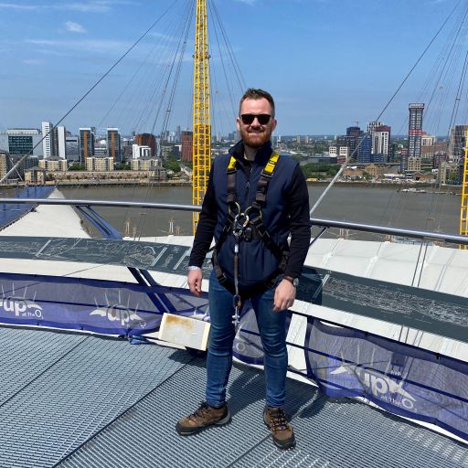 Image of Sam climbing the o2 in London 