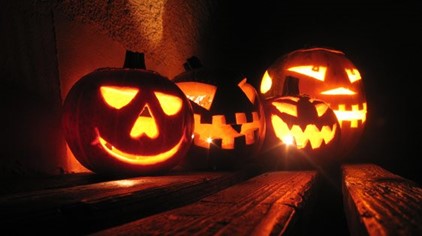 Carved pumpkins glowing in the dark