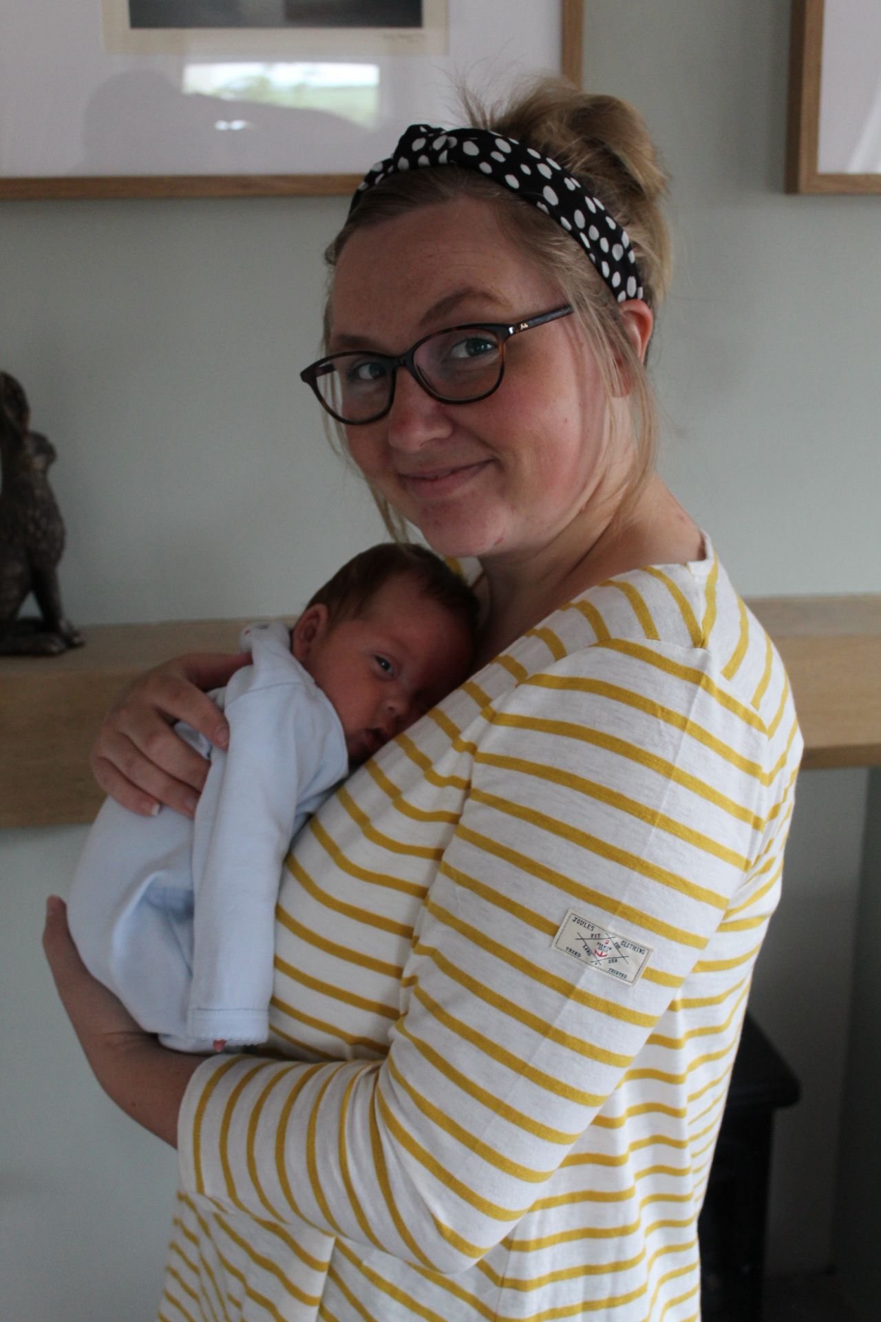 Woman pictured holding her newborn