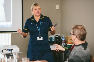 Nurse training a student