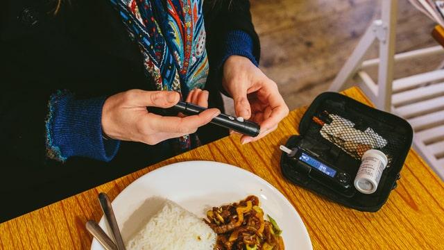 A person living with diabetes managing their condition and checking their blood sugar levels