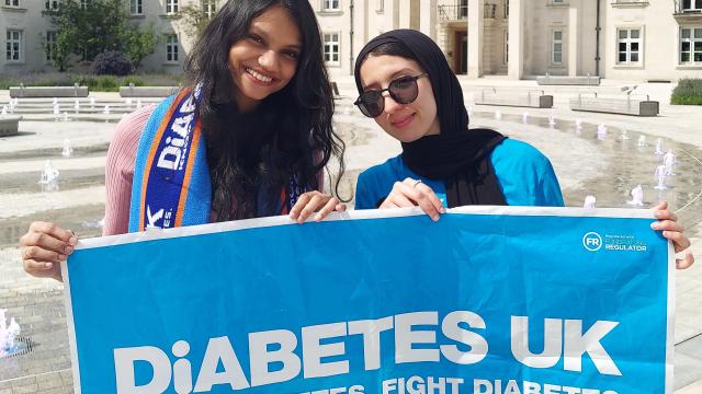 Diabetes UK volunteers holding a banner