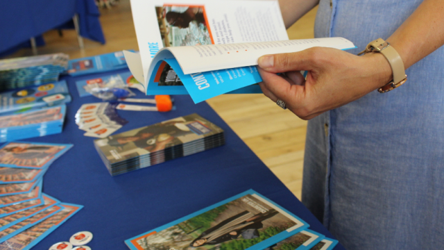 The image shows someone reading a Diabetes UK leaflet.