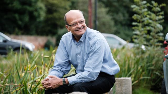 man sits in garden