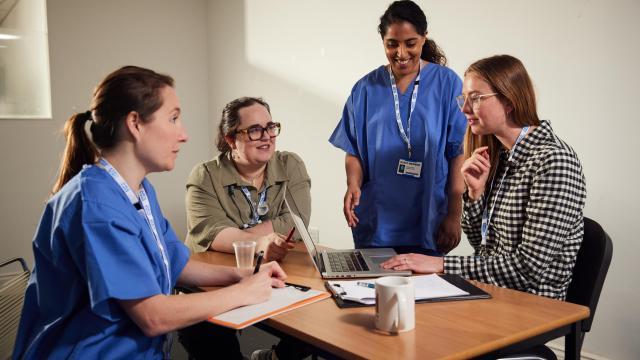 nurses sitting round table