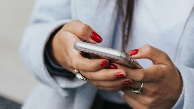 woman sending a text message