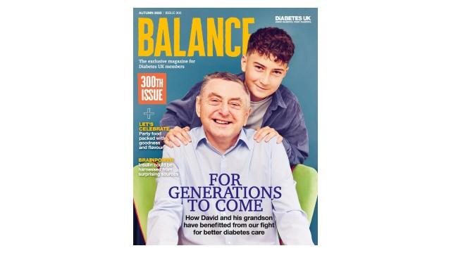 300th issue. Grandad and grandson smiling and looking at camera