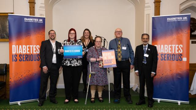 Campaigners in front of Diabetes is Serious banners