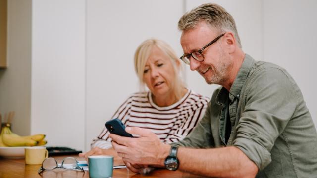 Couple looking at phone together