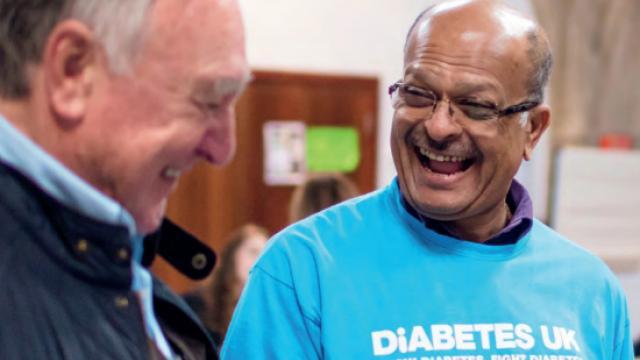 image of two volunteers smiling