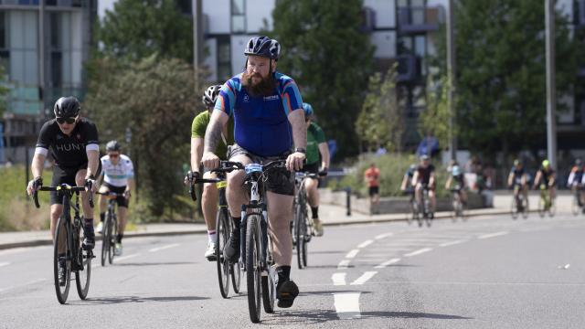 Image of man cycling in Diabetes UK jersey on a road.