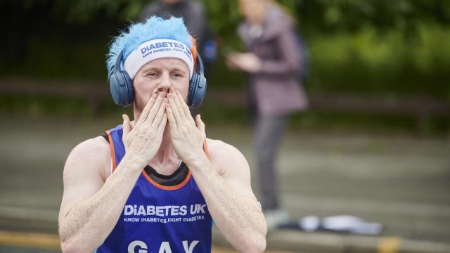 Male runner blowing kisses to the camera