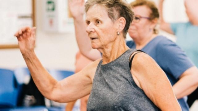 A woman doing exercise with an exercise class