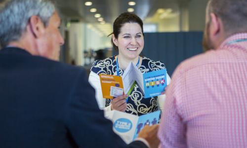 Volunteer handing out leaflets 