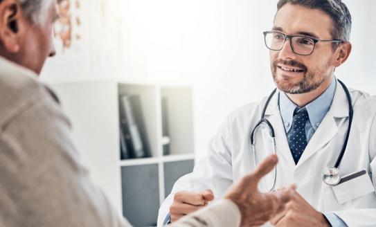 A doctor talking to a patient.