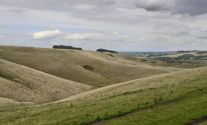 Rolling hills and cloudy sky