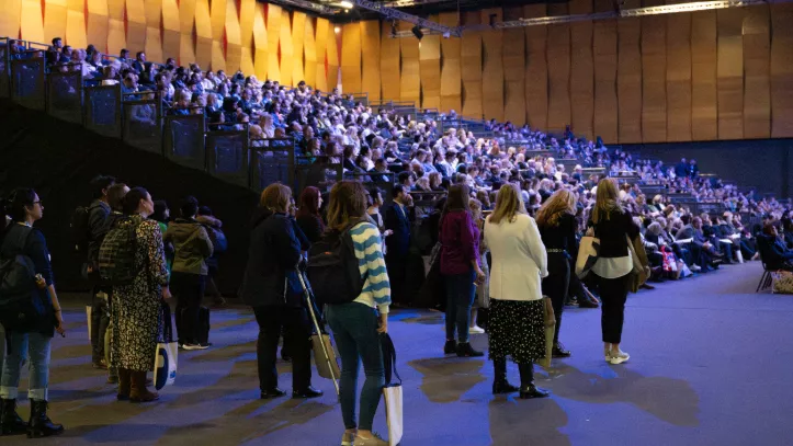 A crowd at a packed-out lecture theatre