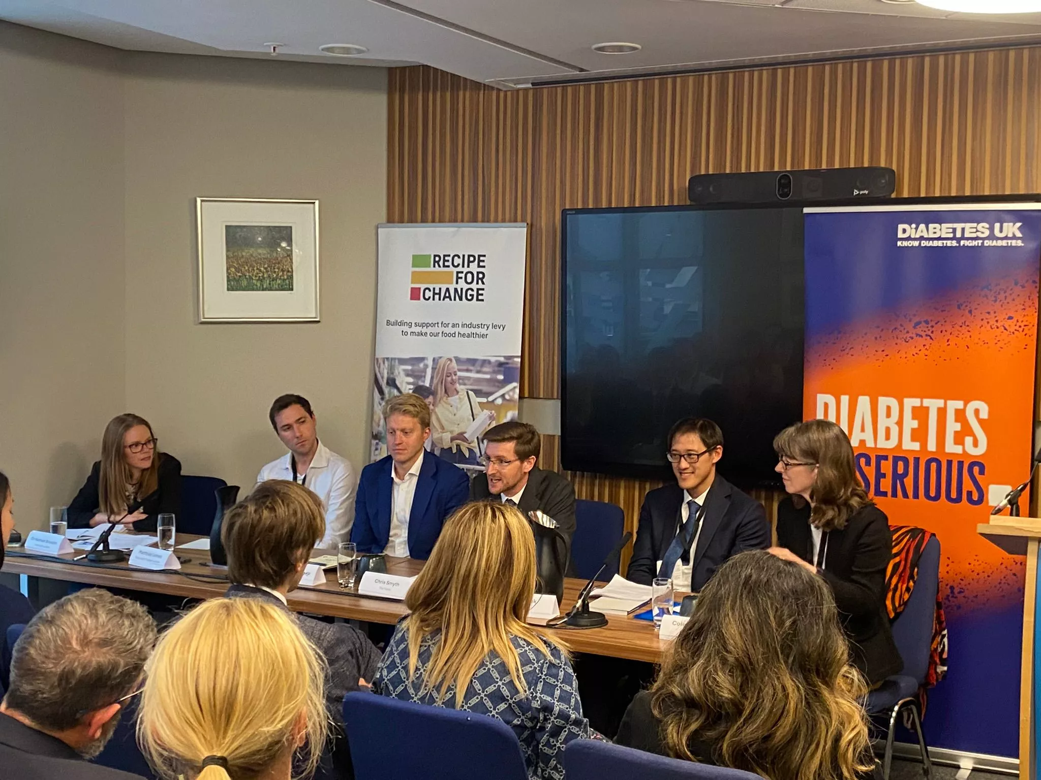 Five people on a panel discussing children's health at party conferences