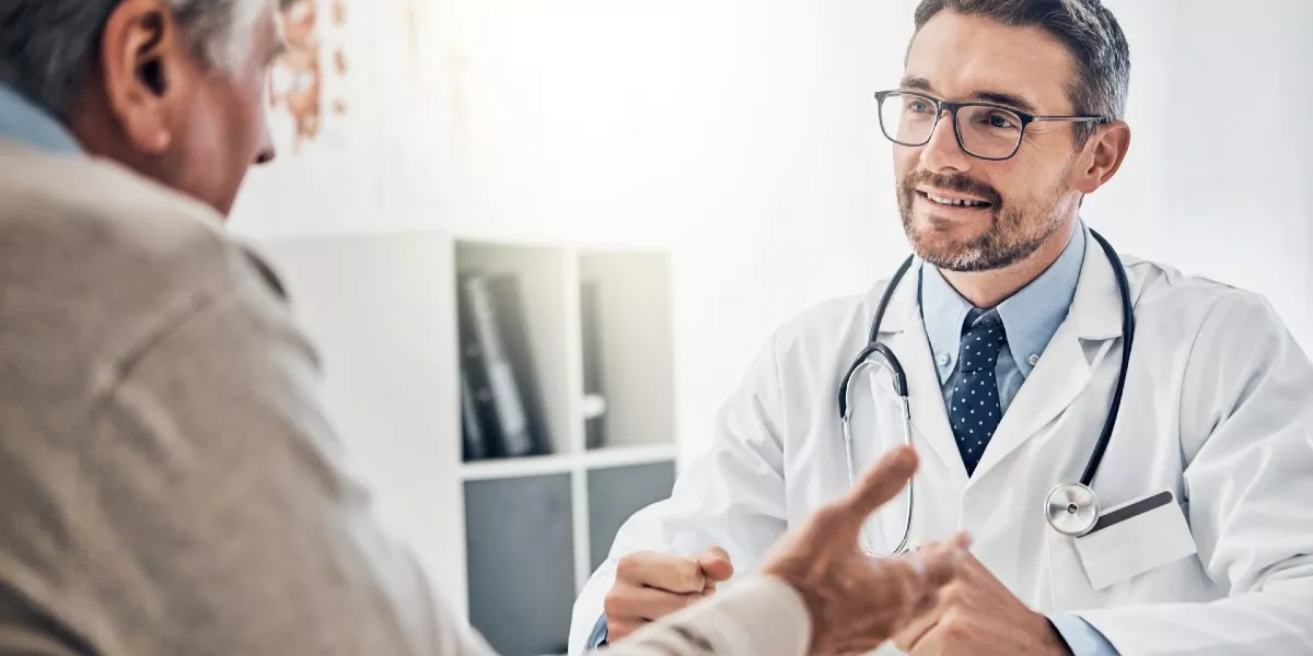 A doctor talking to a patient.