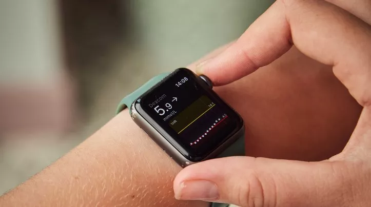 Photo of smart watch showing blood sugar levels