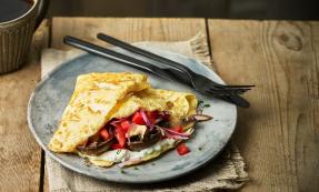 Veggie wraps on plate with knife and fork