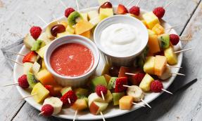 Skewered fruit with dipping sauces