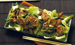 Spicy ginger and garlic pork with pak choi