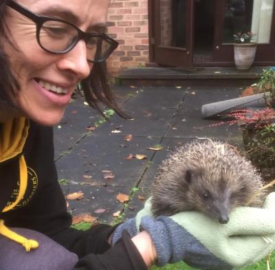 Prof Nia Bryant holding a hedgehog