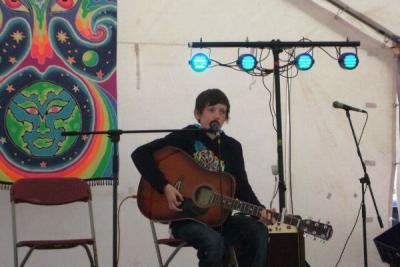 Tom as a teenager playing guitar